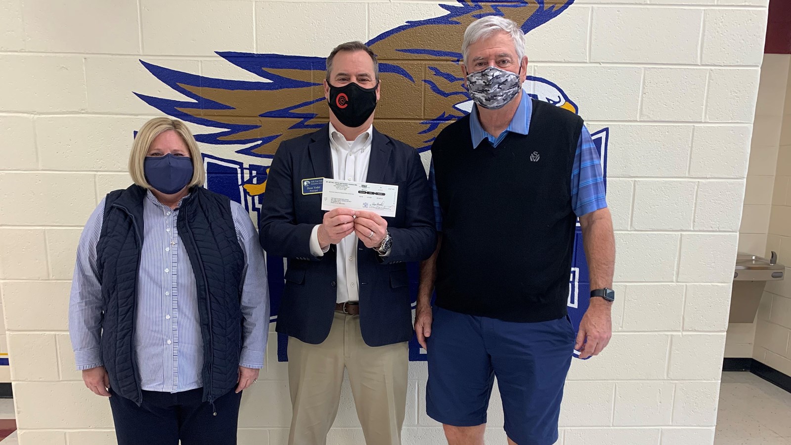 Backpack Blessings Presents Check to Fair Oaks Elementary